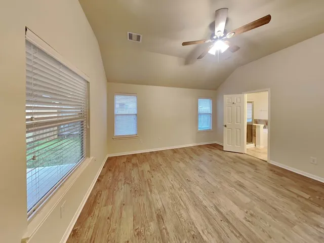 a view of a room that has a window in it