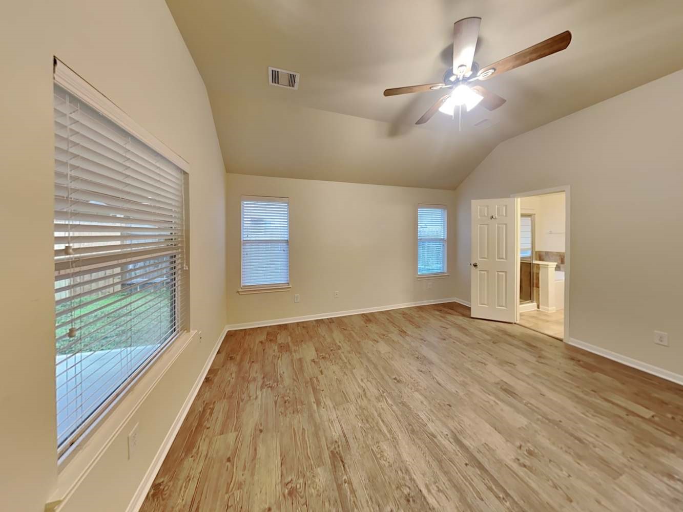 30619 Ginger Trace Drive Spring, TX 77386 - Photo 10 of 16 a view of an empty room with wooden floor and a window