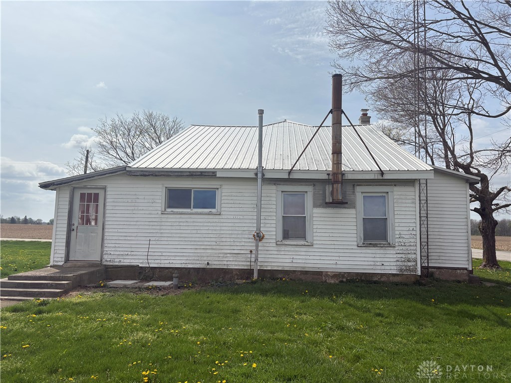 9006 Oakes Road Arcanum, OH 45304 - Photo 3 of 29 This charming farmhouse offers serene country living with a metal roof and ample outdoor space.