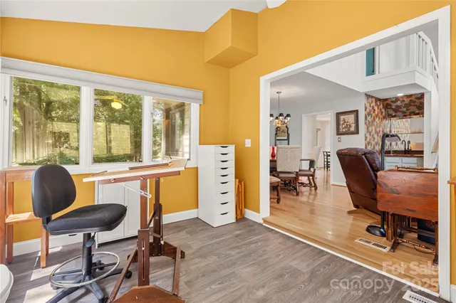 a view of a livingroom with furniture and a window
