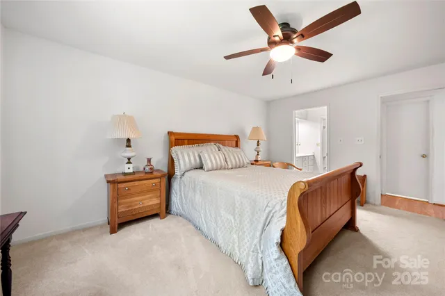 a bedroom with bed and window