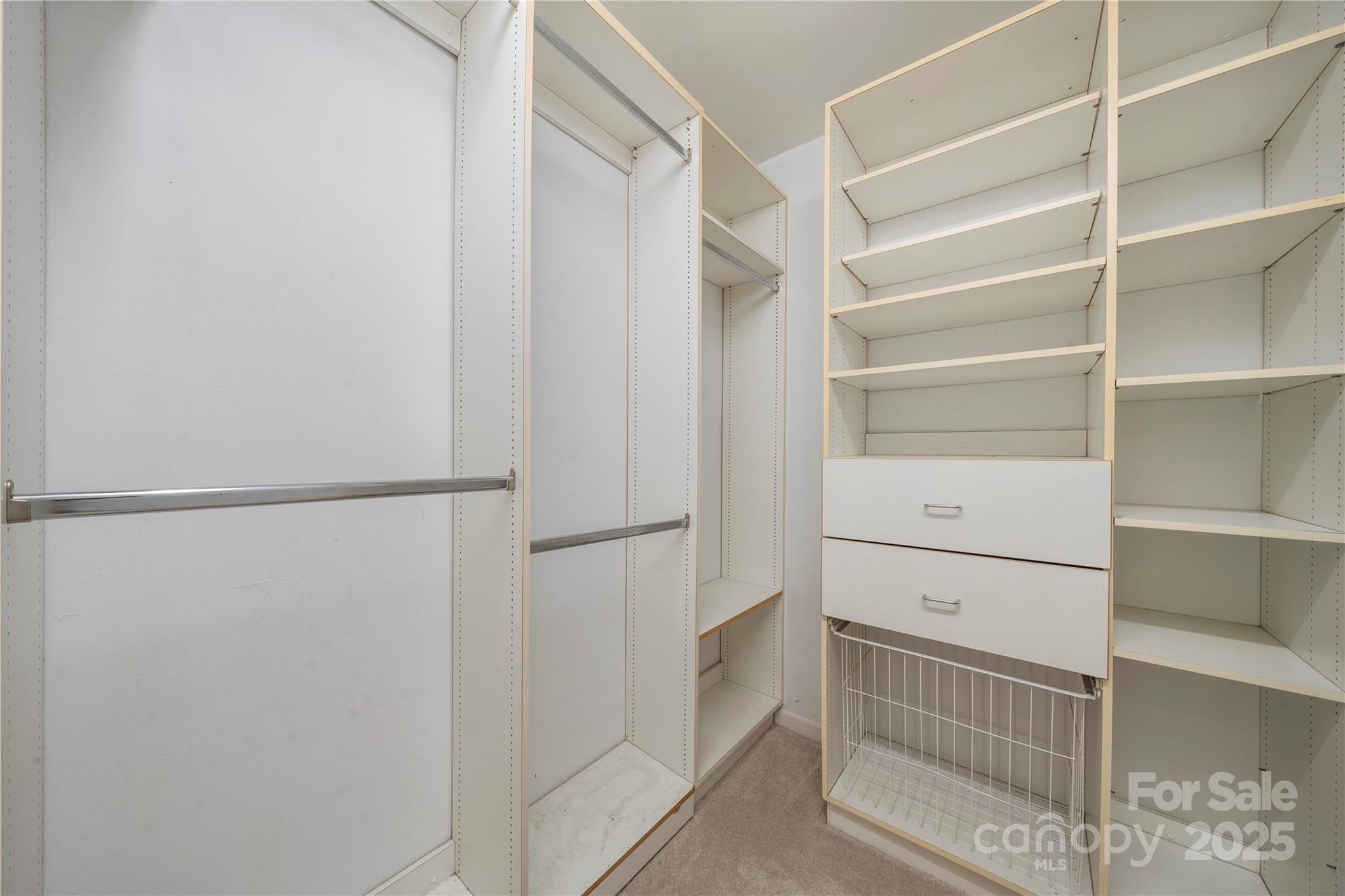 8928 St Croix Lane Charlotte, NC 28277 - Photo 29 of 37 a view of walk in closet with empty racks