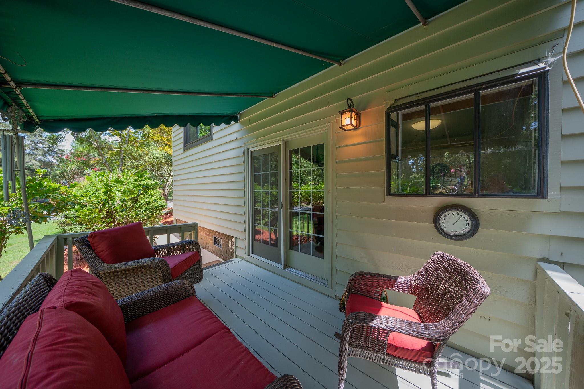 8928 St Croix Lane Charlotte, NC 28277 - Photo 30 of 37 a outdoor living space with furniture and a black umbrella