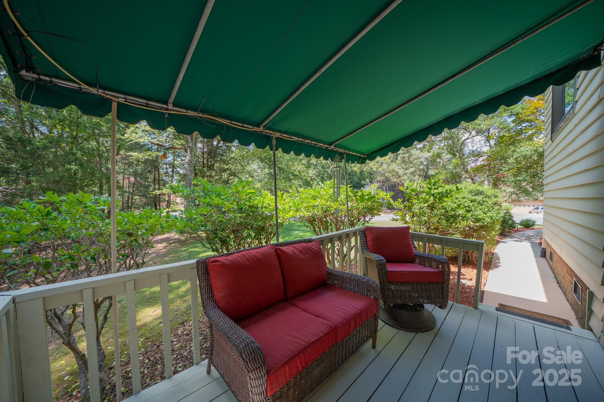 8928 St Croix Lane Charlotte, NC 28277 - Photo 32 of 37 a balcony with wooden floor and outdoor seating