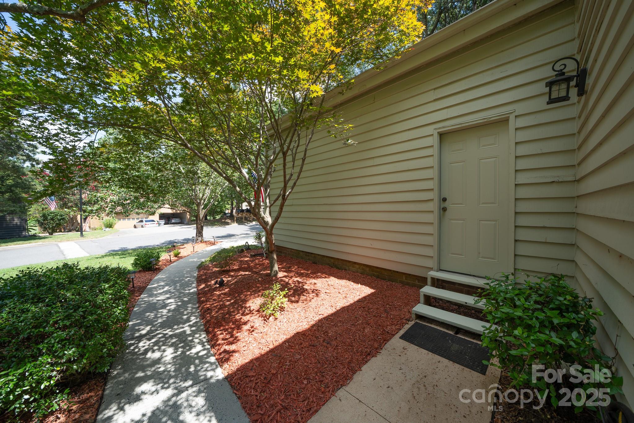 8928 St Croix Lane Charlotte, NC 28277 - Photo 33 of 37 a backyard of a house with lots of green space