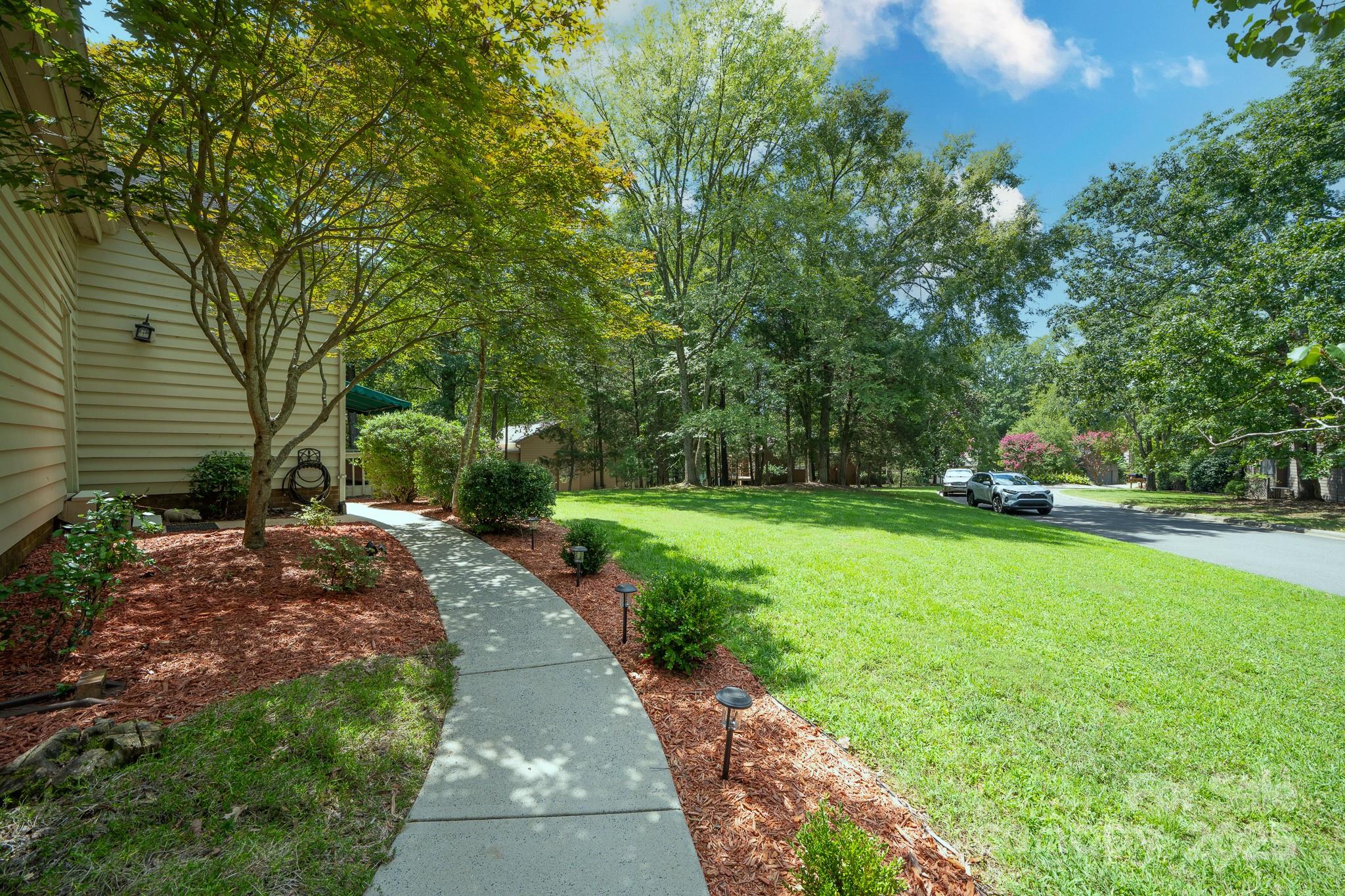 8928 St Croix Lane Charlotte, NC 28277 - Photo 6 of 37 a park view with a sitting space