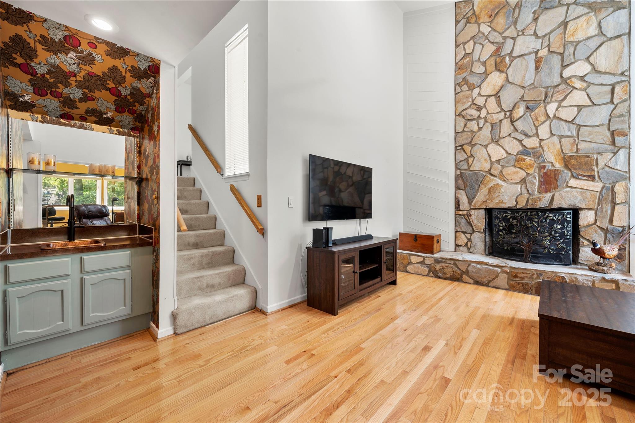 8928 St Croix Lane Charlotte, NC 28277 - Photo 9 of 37 a view of a livingroom with wooden floor and a fireplace