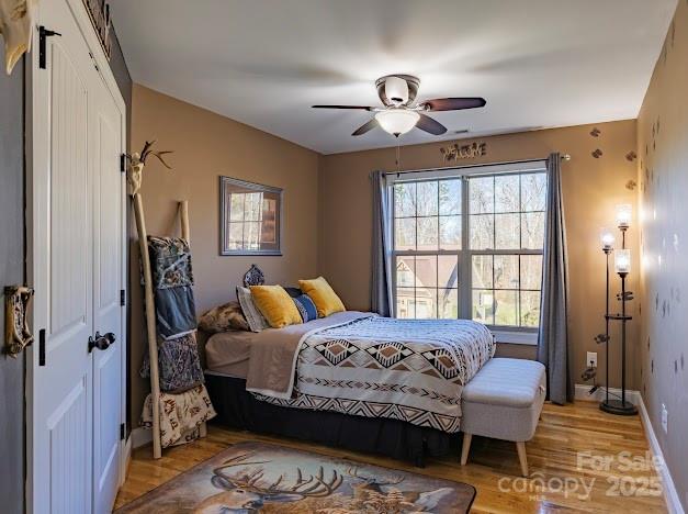 117 Maplewood Court Hudson, NC 28638 - Photo 21 of 48 a bedroom with a bed and a chandelier