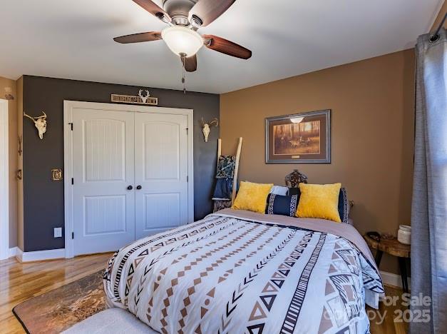 117 Maplewood Court Hudson, NC 28638 - Photo 22 of 48 a bedroom with a bed and a chandelier