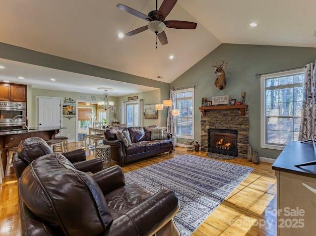 117 Maplewood Court Hudson, NC 28638 - Photo 28 of 48 a living room with furniture a fireplace and a flat screen tv