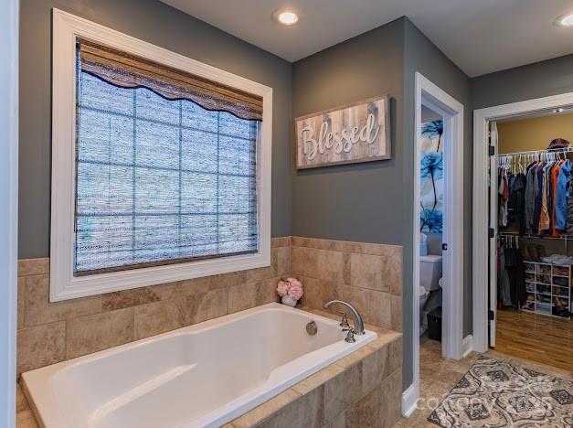 117 Maplewood Court Hudson, NC 28638 - Photo 32 of 48 a bathroom with a bathtub and a shower