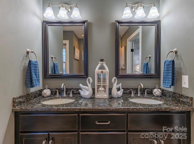 117 Maplewood Court Hudson, NC 28638 - Photo 34 of 48 a bathroom with granite countertop double vanity and a mirror