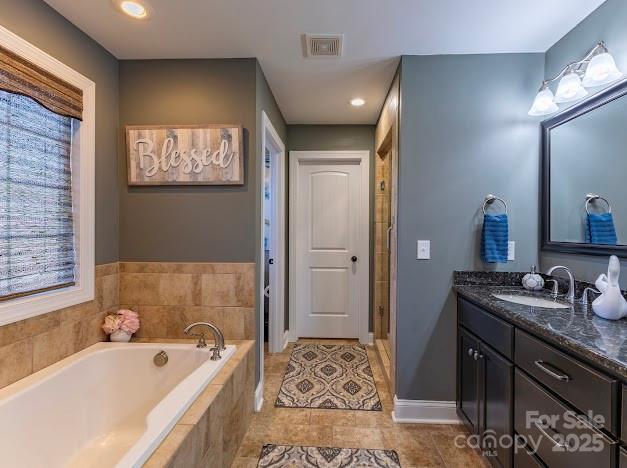 117 Maplewood Court Hudson, NC 28638 - Photo 35 of 48 a spacious bathroom with a tub sink and mirror
