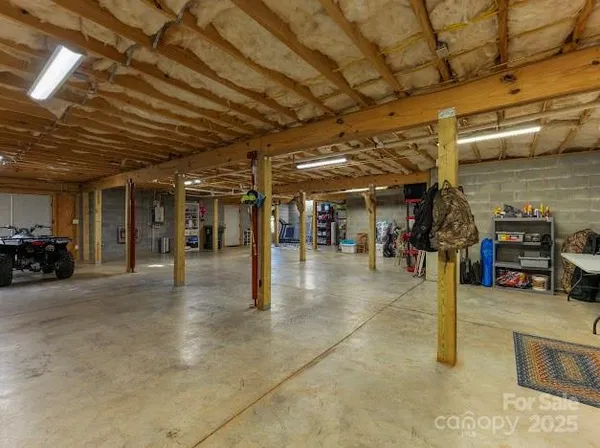 a view of a dinning room with wooden floor and a yard