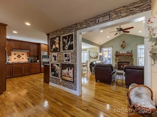 a living room with fireplace furniture and a flat screen tv