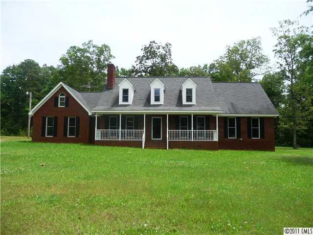 4519 Wolf Pond Road Monroe, NC 28112 - Photo 1 of 16 a view of a house with a yard
