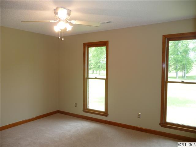 4519 Wolf Pond Road Monroe, NC 28112 - Photo 11 of 16 an empty room with a window
