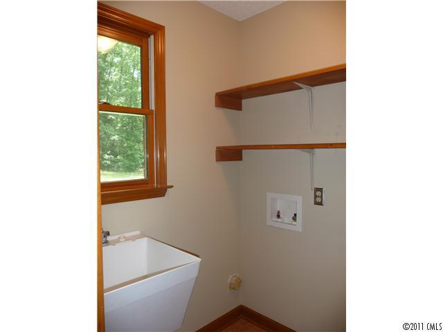 4519 Wolf Pond Road Monroe, NC 28112 - Photo 12 of 16 a bathroom with a bathtub