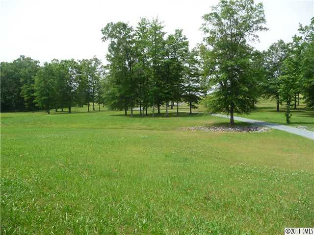 4519 Wolf Pond Road Monroe, NC 28112 - Photo 14 of 16 a view of outdoor space with deck and yard