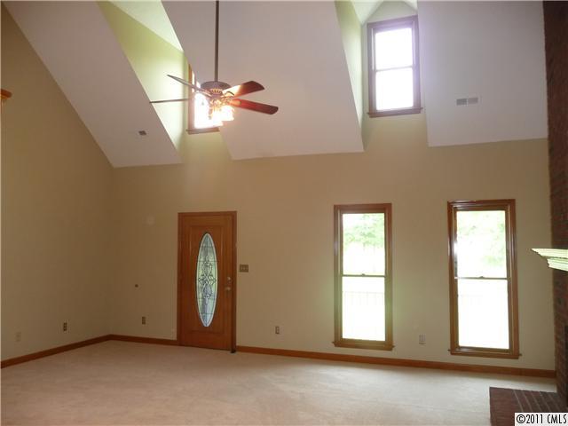 4519 Wolf Pond Road Monroe, NC 28112 - Photo 5 of 16 a view of a room with windows