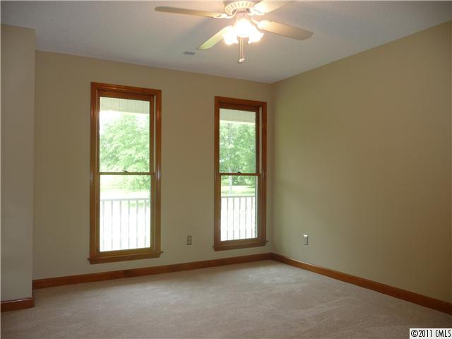 4519 Wolf Pond Road Monroe, NC 28112 - Photo 10 of 16 an empty room with a window