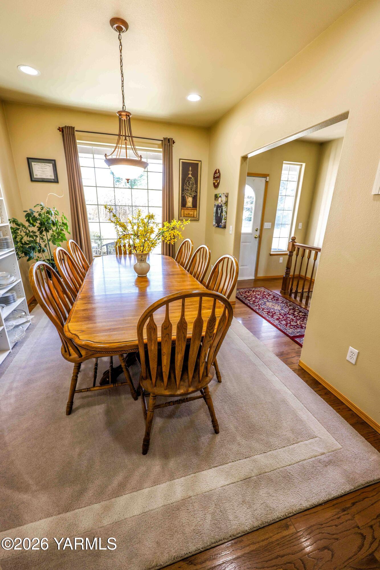 224 Heysman Road Selah, WA 98942 - Photo 11 of 28 a view of a dining room with furniture window and wooden floor
