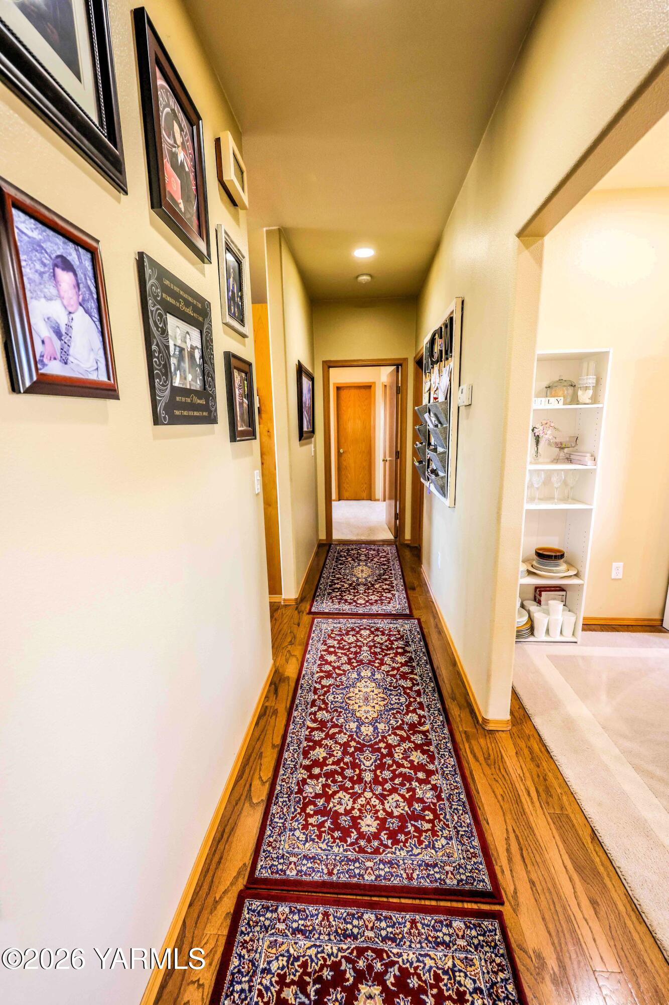 224 Heysman Road Selah, WA 98942 - Photo 13 of 28 a view of a hallway with wooden floor