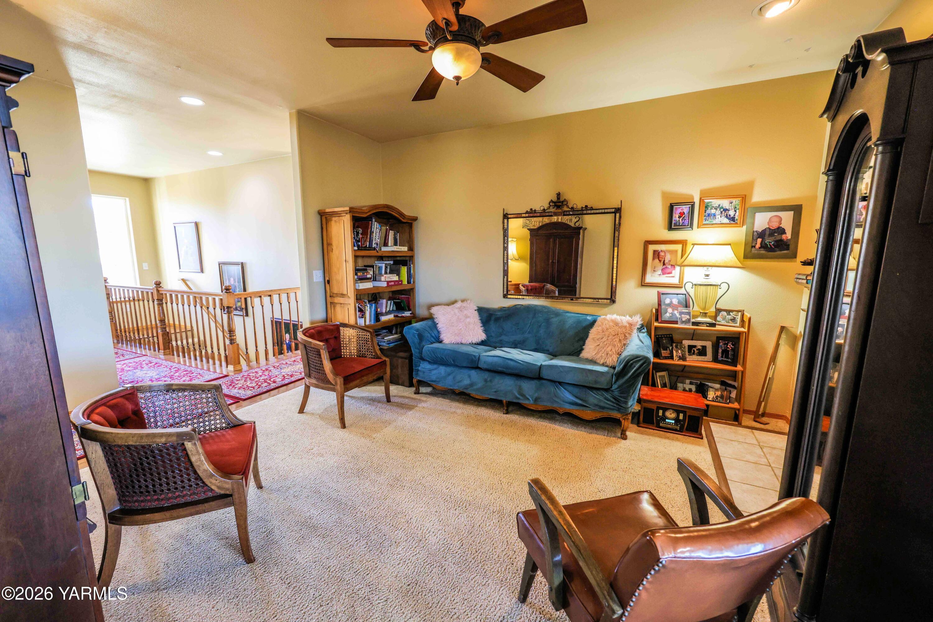 224 Heysman Road Selah, WA 98942 - Photo 16 of 28 a living room with furniture a fireplace and a chandelier