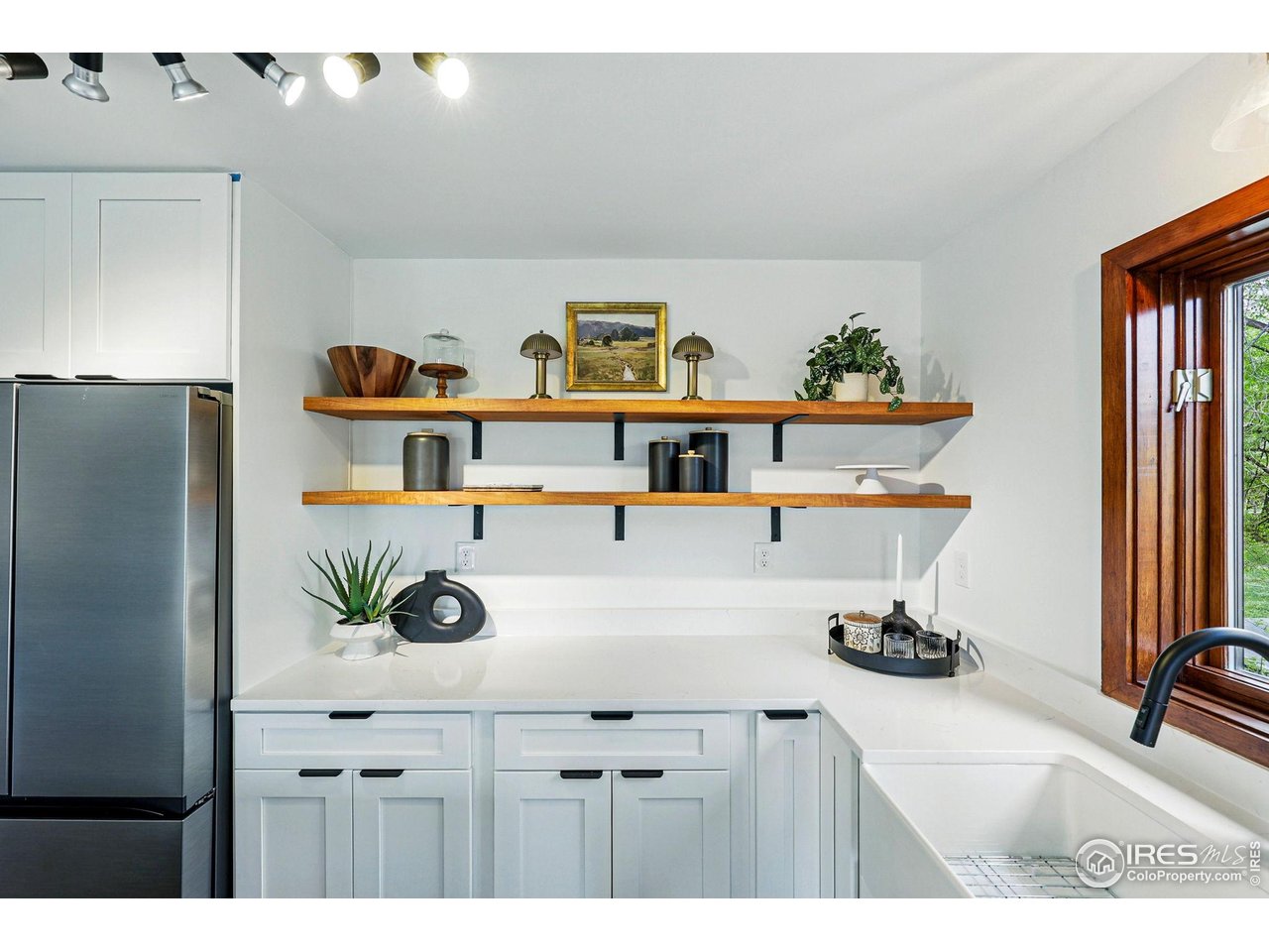 4731 Jay Road Boulder, CO 80301 - Photo 11 of 50 a kitchen with a refrigerator and wooden floor