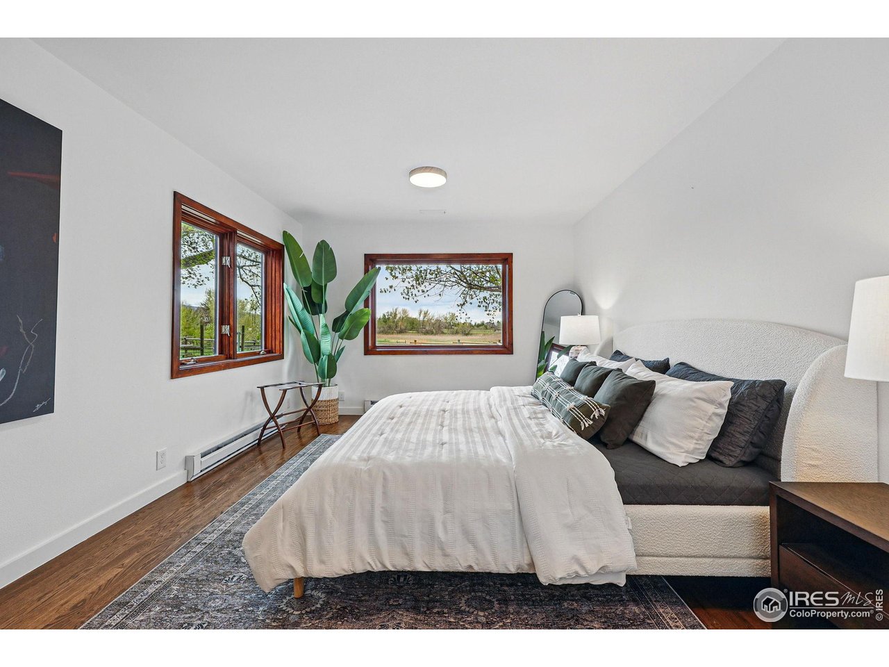 4731 Jay Road Boulder, CO 80301 - Photo 23 of 50 a bedroom with a bed and a large window
