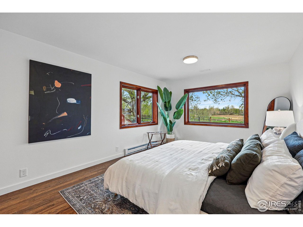 4731 Jay Road Boulder, CO 80301 - Photo 29 of 50 a bedroom with a bed and a painting on the wall