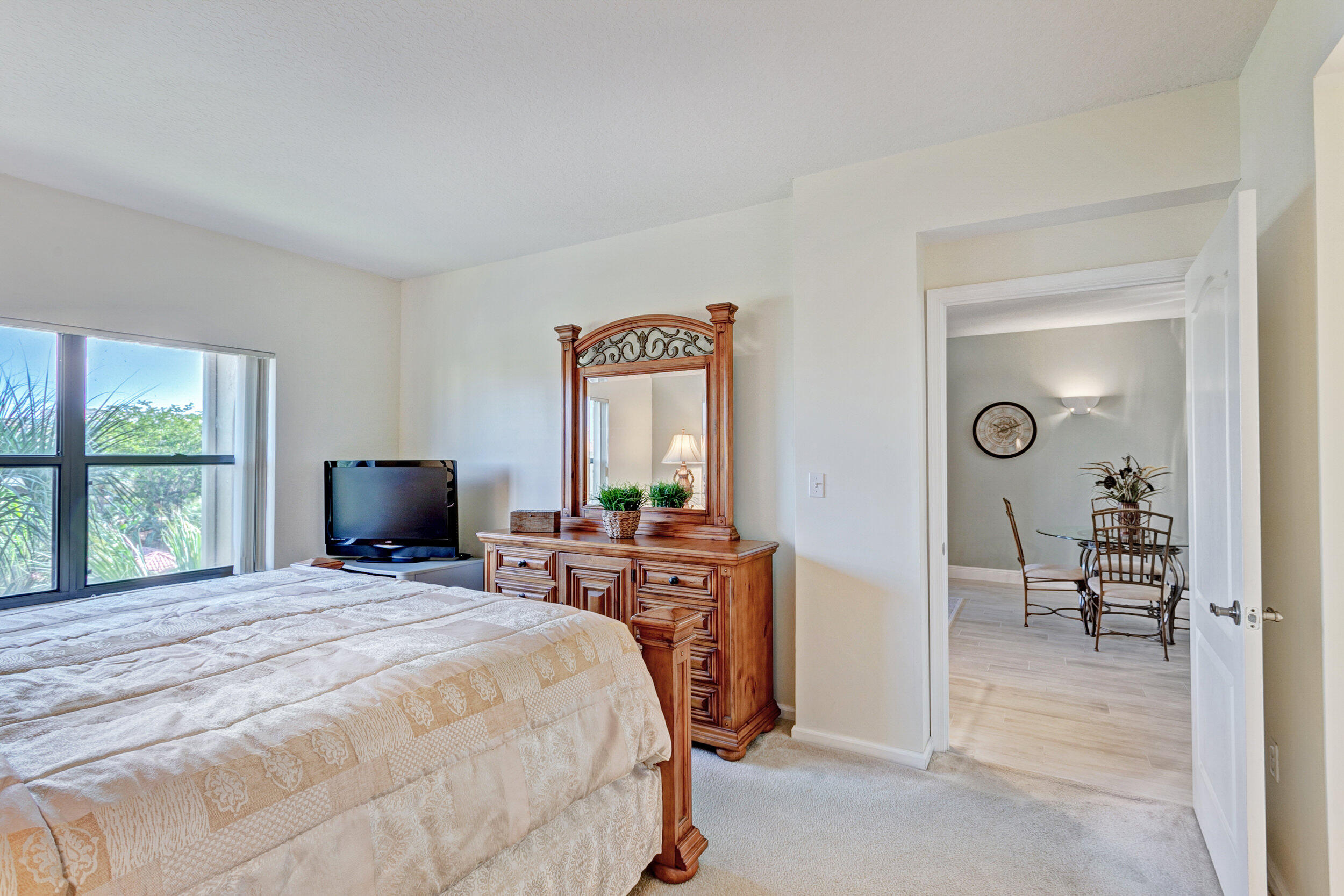500 Uno Lago Drive, Unit 402 Juno Beach, FL 33408 - Photo 20 of 36 Primary Bedroom