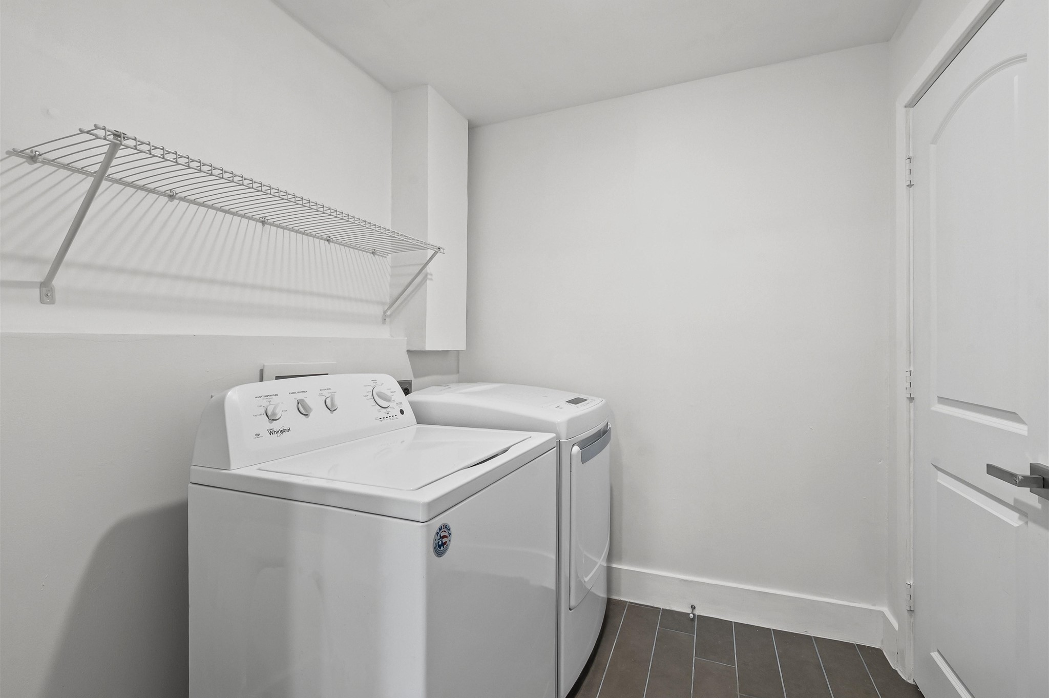 4826 Culmore Drive Houston, TX 77021 - Photo 15 of 21 The laundry room is tucked away near the kitchen, conveniently offering function with a clean, simple design. A space that supports the home life without taking center stage.