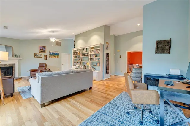 a dining room with furniture and wooden floor