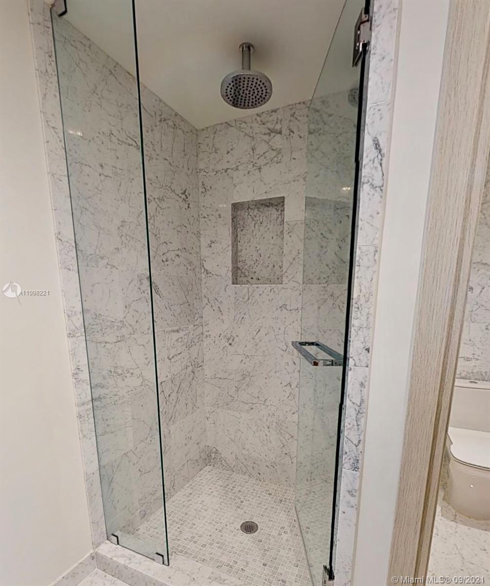1000 Brickell Plaza, Unit 4907 Miami, FL 33131 - Photo 16 of 26 a bathroom with a shower