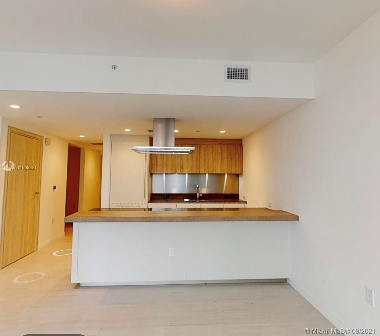 1000 Brickell Plaza, Unit 4907 Miami, FL 33131 - Photo 18 of 26 a view of kitchen with stainless steel appliances granite countertop refrigerator sink and stove