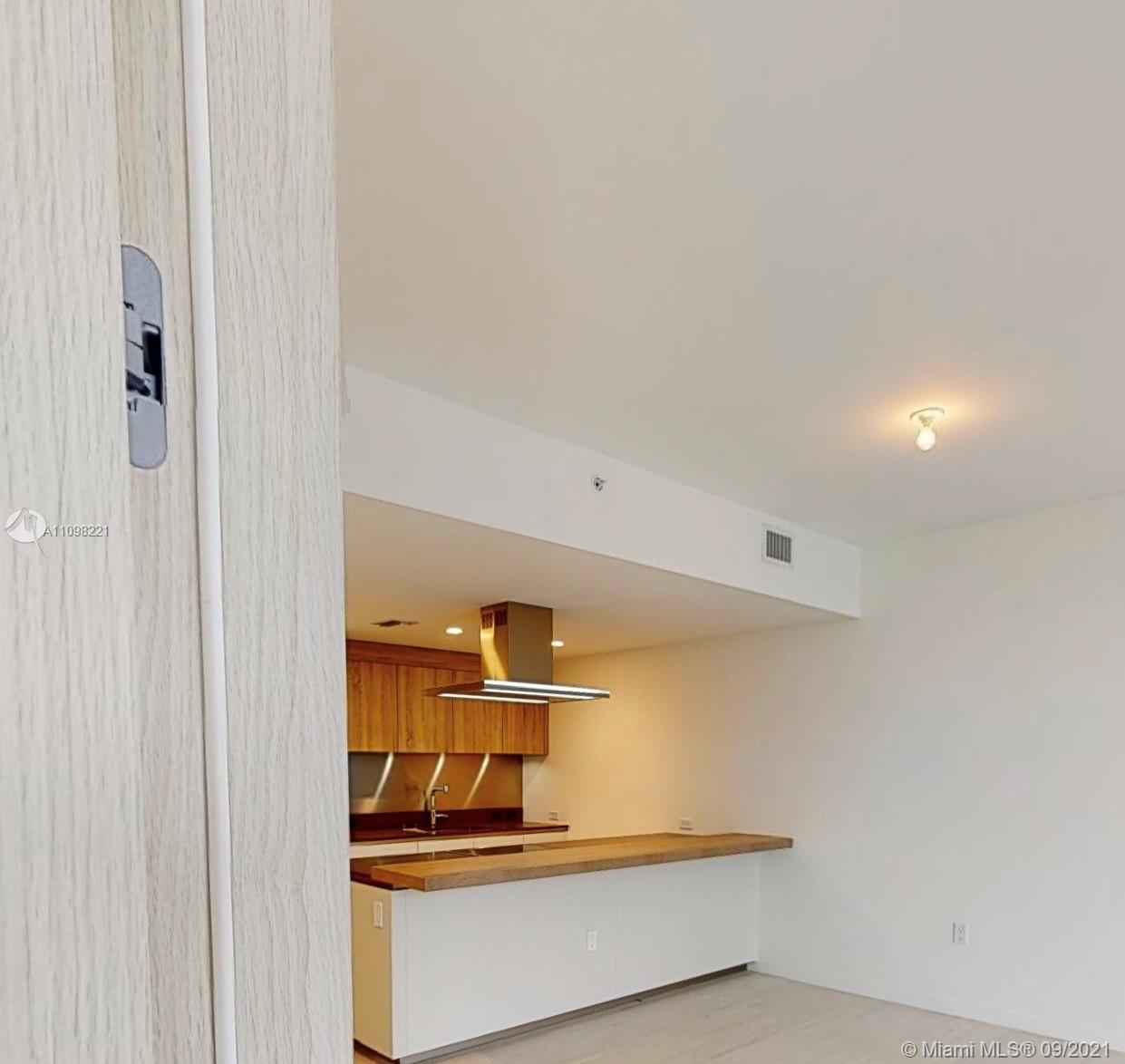 1000 Brickell Plaza, Unit 4907 Miami, FL 33131 - Photo 21 of 26 a view of a hallway with a room