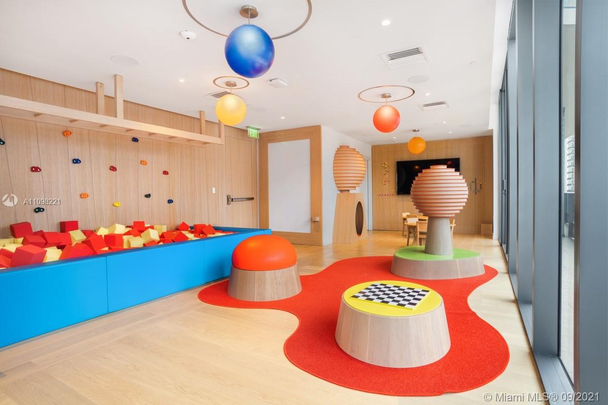 1000 Brickell Plaza, Unit 4907 Miami, FL 33131 - Photo 6 of 26 a bathroom with a sink and mirror with toilet