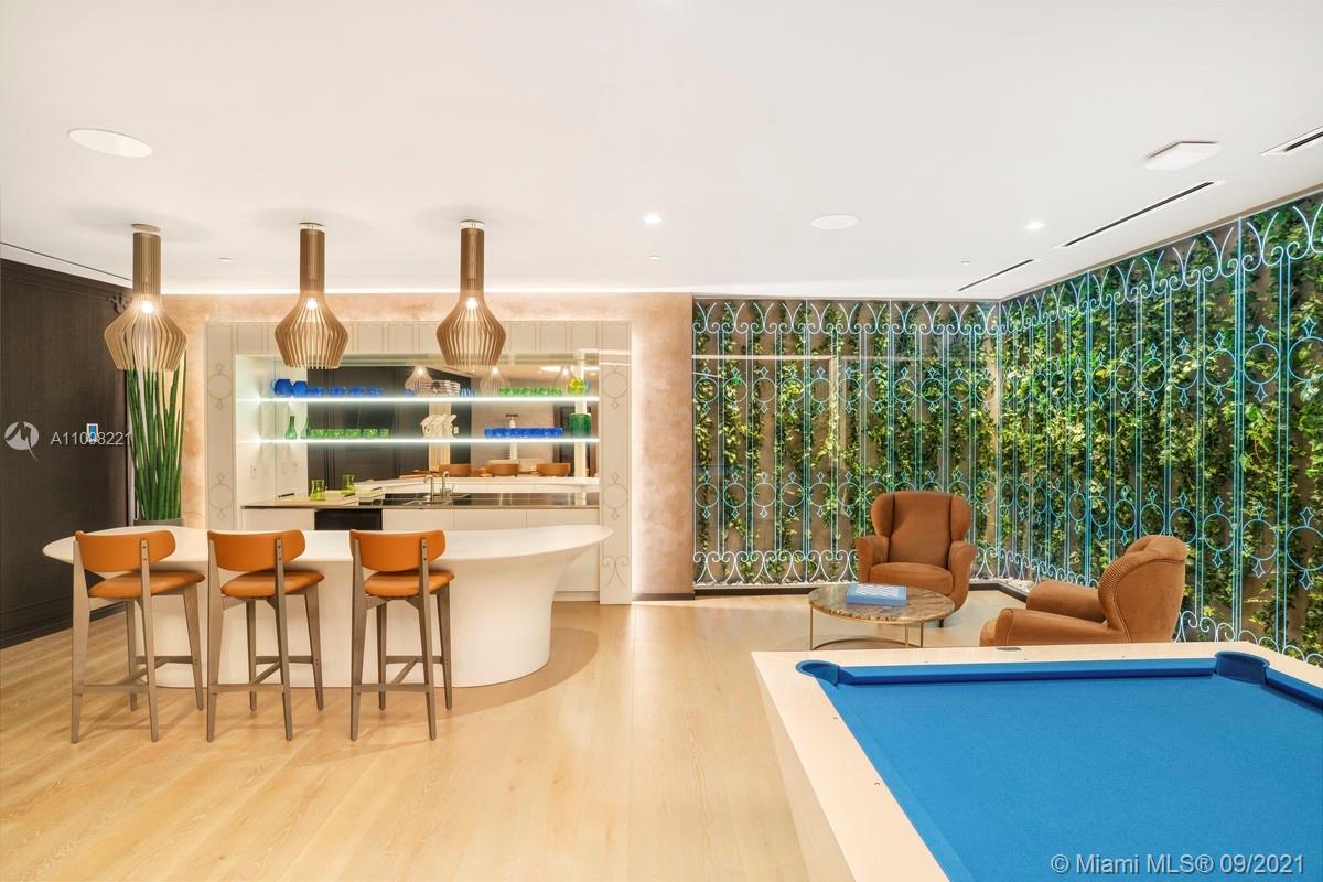 1000 Brickell Plaza, Unit 4907 Miami, FL 33131 - Photo 7 of 26 a dining room with furniture and a large window