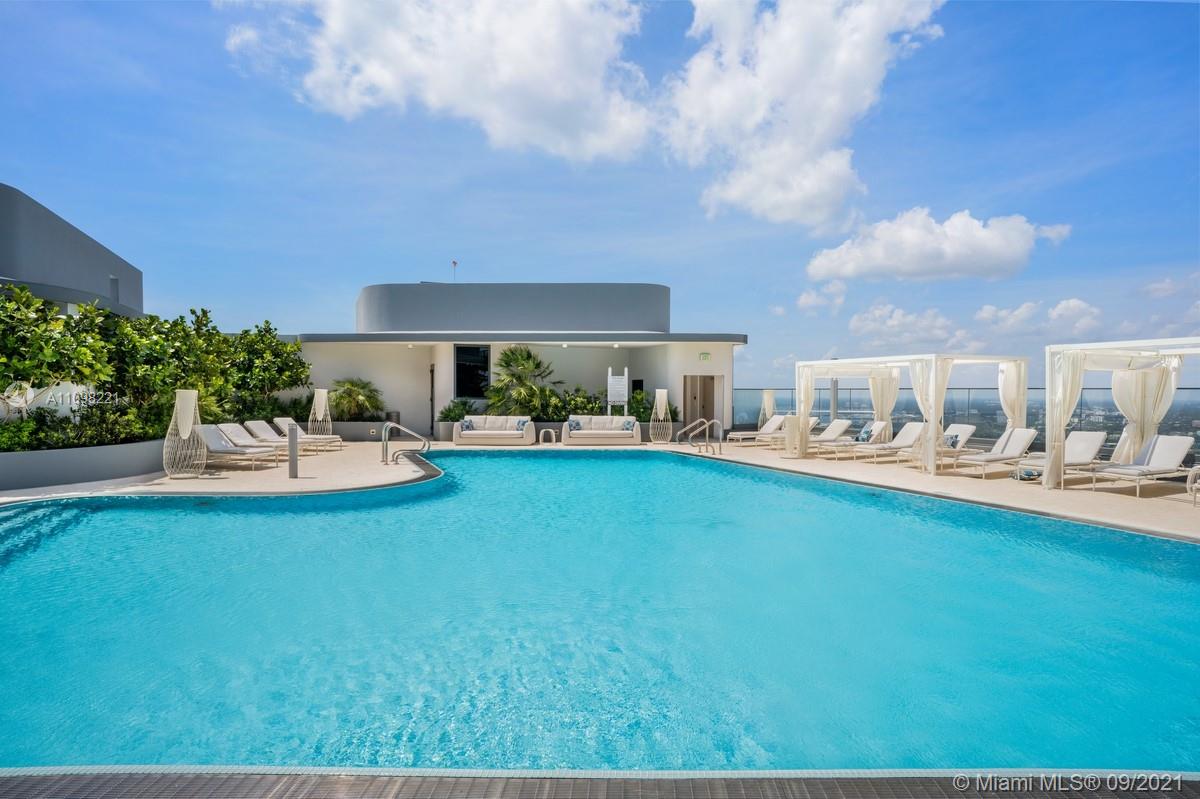 1000 Brickell Plaza, Unit 4907 Miami, FL 33131 - Photo 8 of 26 a front view of a house with garden