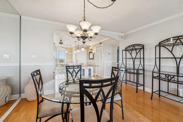 a living room with furniture and view of kitchen