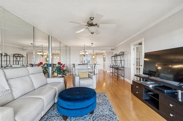 a view of a room with furniture and floor to ceiling windows