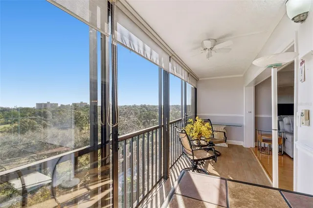 a view of a livingroom with furniture and a flat screen tv