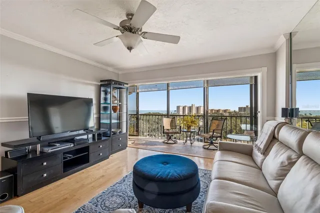 a large white kitchen with lots of counter space a sink appliances and cabinets