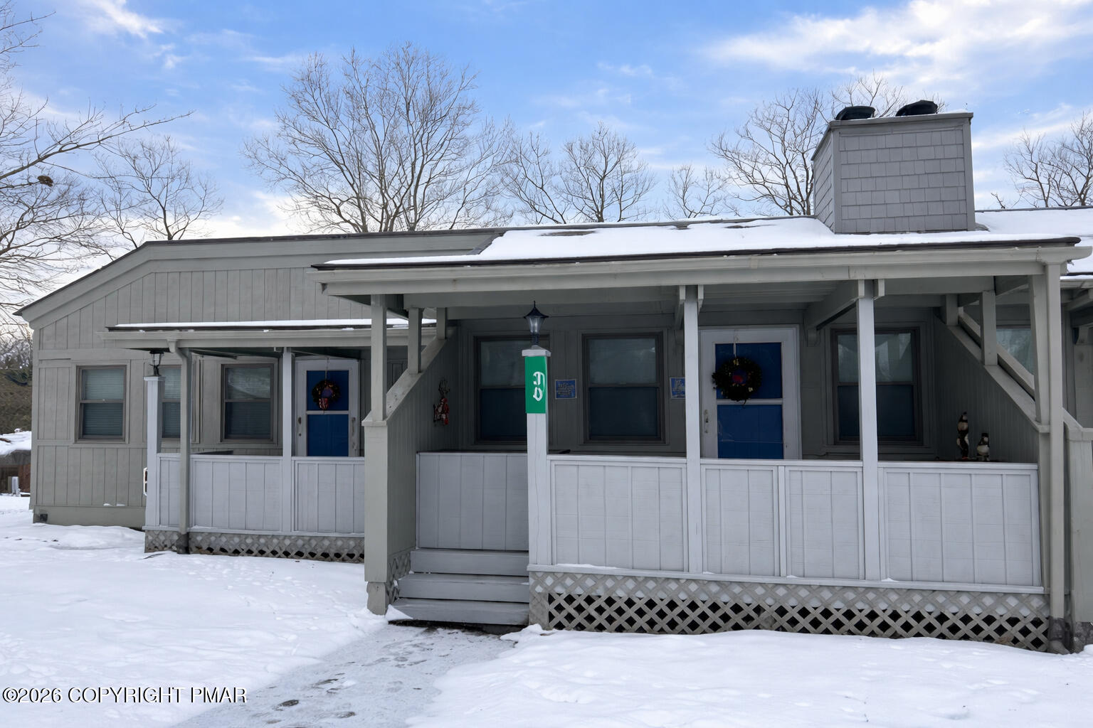 113 Condor Drive, Unit 30 Tamiment, PA 18371 - Photo 2 of 20 a view of a house with a yard