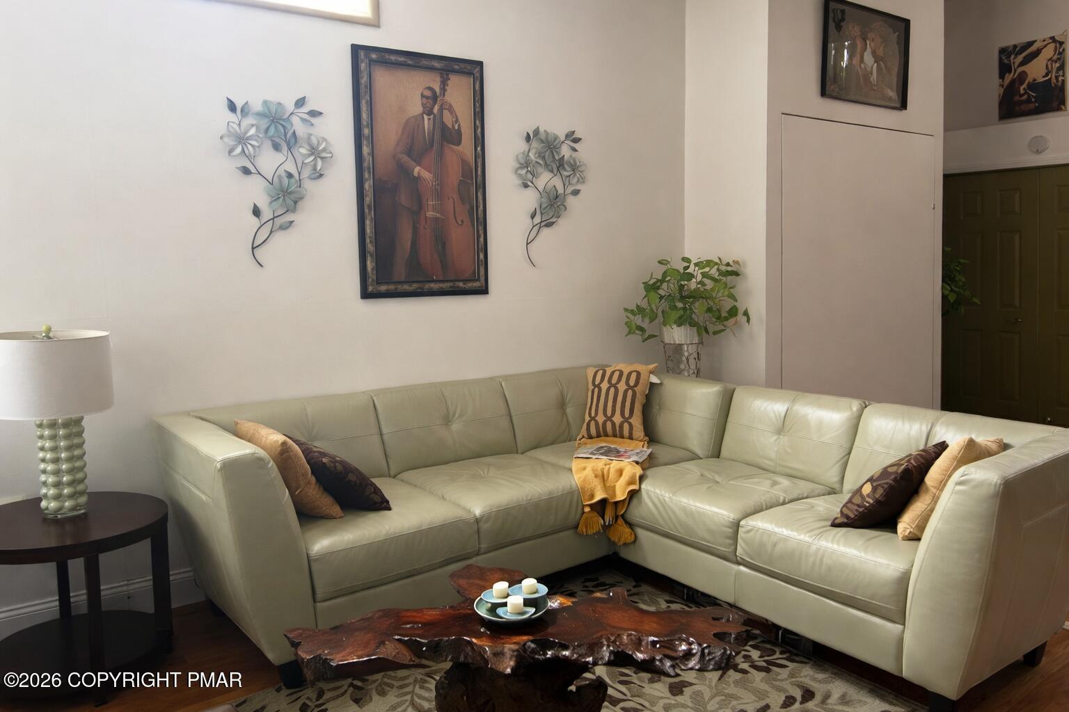 113 Condor Drive, Unit 30 Tamiment, PA 18371 - Photo 3 of 20 a living room with furniture a couch and painting on the wall