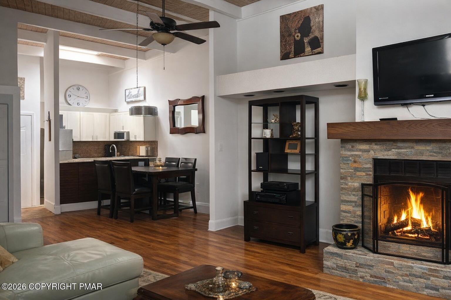 113 Condor Drive, Unit 30 Tamiment, PA 18371 - Photo 6 of 20 a living room with furniture and a fireplace