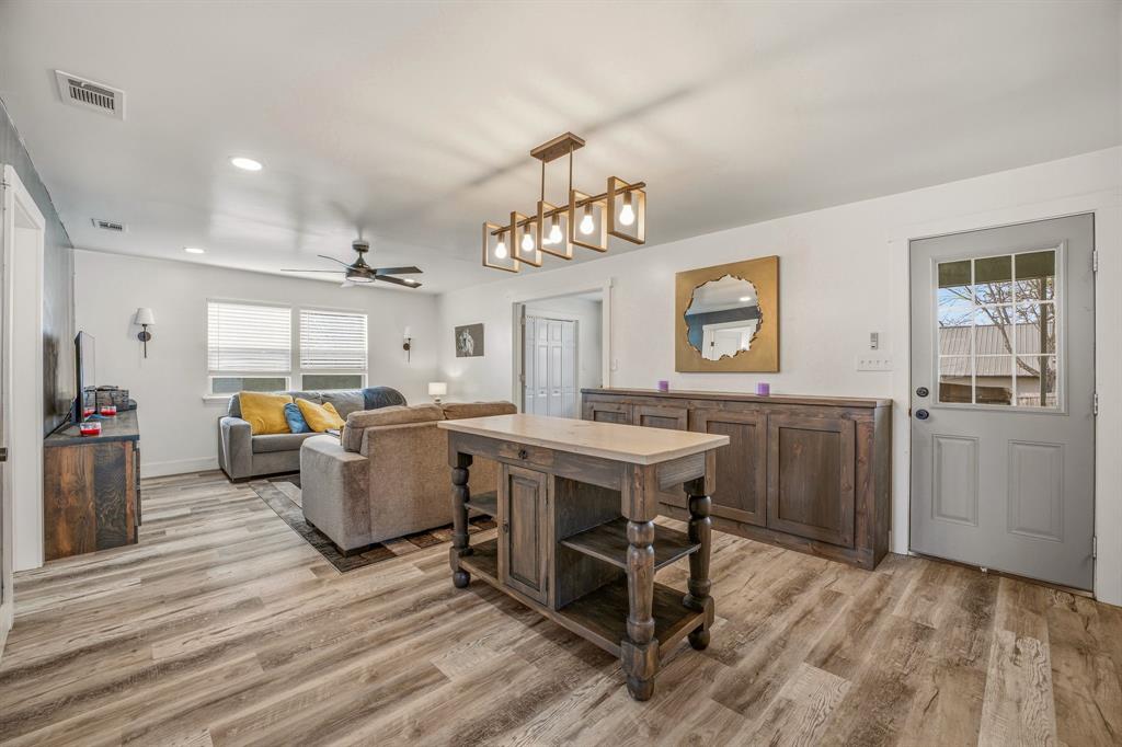 412 North Kirk Street Hico, TX 76457 - Photo 11 of 25 a view of kitchen with furniture and wooden floor