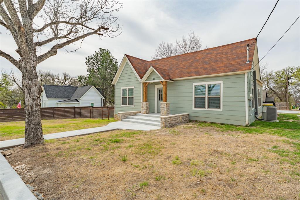 412 North Kirk Street Hico, TX 76457 - Photo 2 of 25 a view of pool with a backyard
