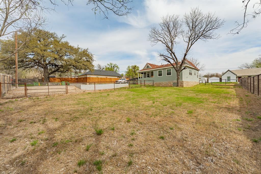 412 North Kirk Street Hico, TX 76457 - Photo 24 of 25 a swimming pool with trees in front of it
